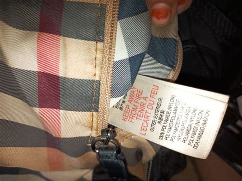 would authentic burberry have ykk zipper pulls on wool lining|Burberry bag logo.